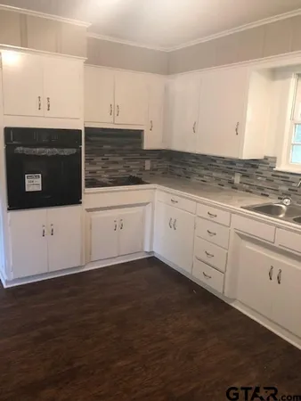 a view of a livingroom with wooden floor