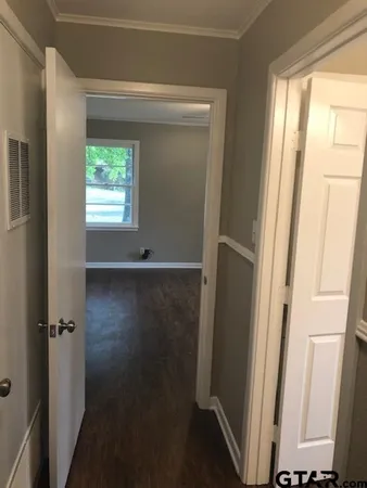 a bathroom with a sink toilet and window