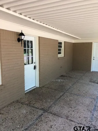 an empty room with wooden floor