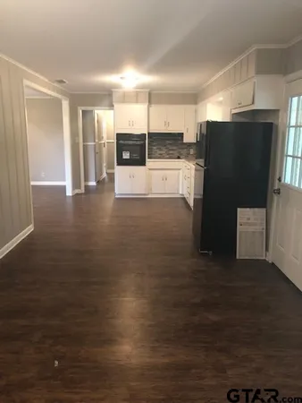 a view of room with hardwood floor