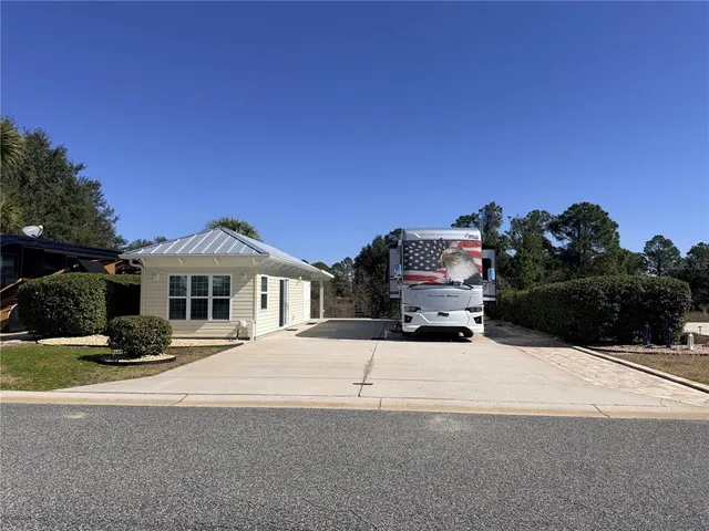 a view of a house with a snow in the background