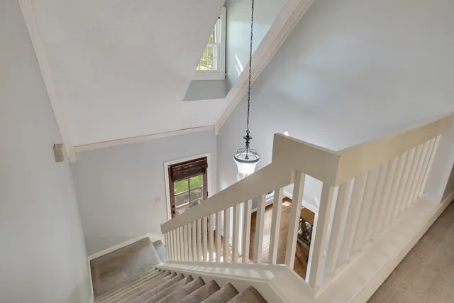 a view of entryway with stairs and wooden floor