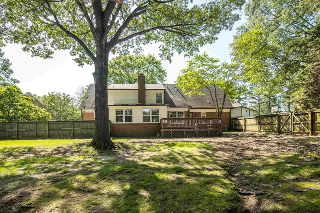 a view of yard with swimming pool