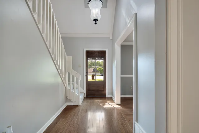 a view of entryway with wooden floor