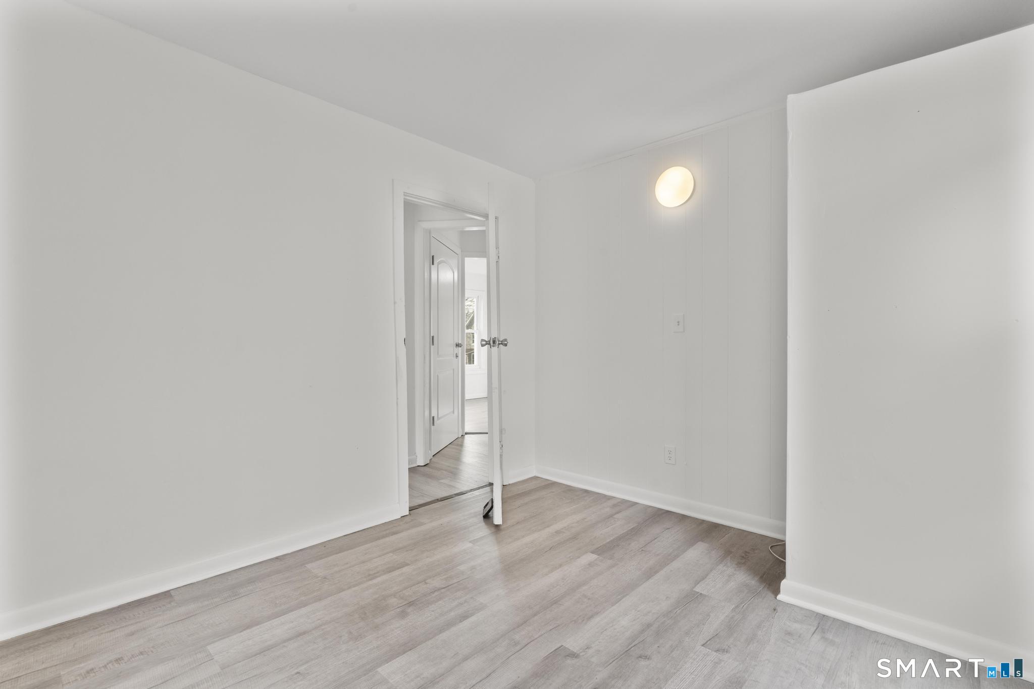 426 Poplar Street New Haven, CT 06513 - Photo 16 of 25 a view of an empty room with wooden floor