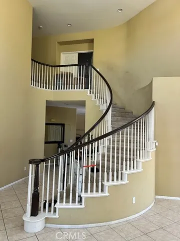 a view of staircase with black white walls