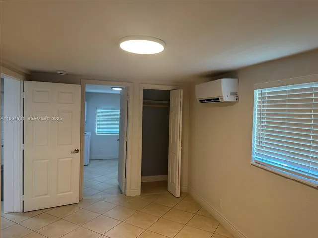 a bathroom with a toilet a sink and a window