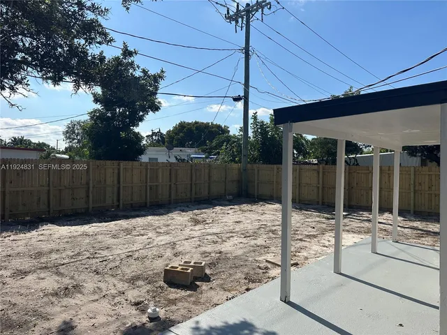 a view of outdoor space with wooden fence