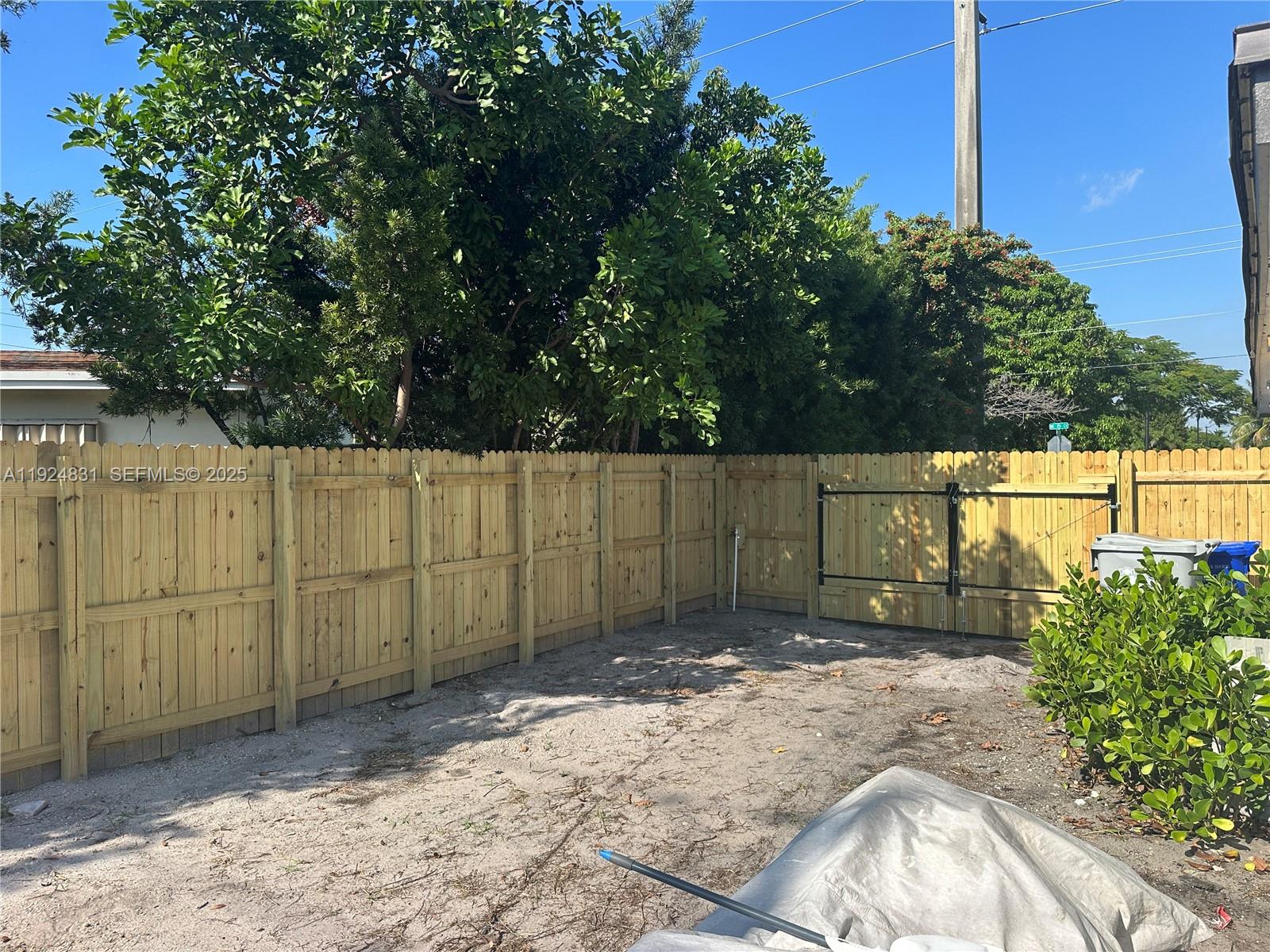 1264 Northeast 25th Court Pompano Beach, FL 33064 - Photo 18 of 19 a view of a backyard