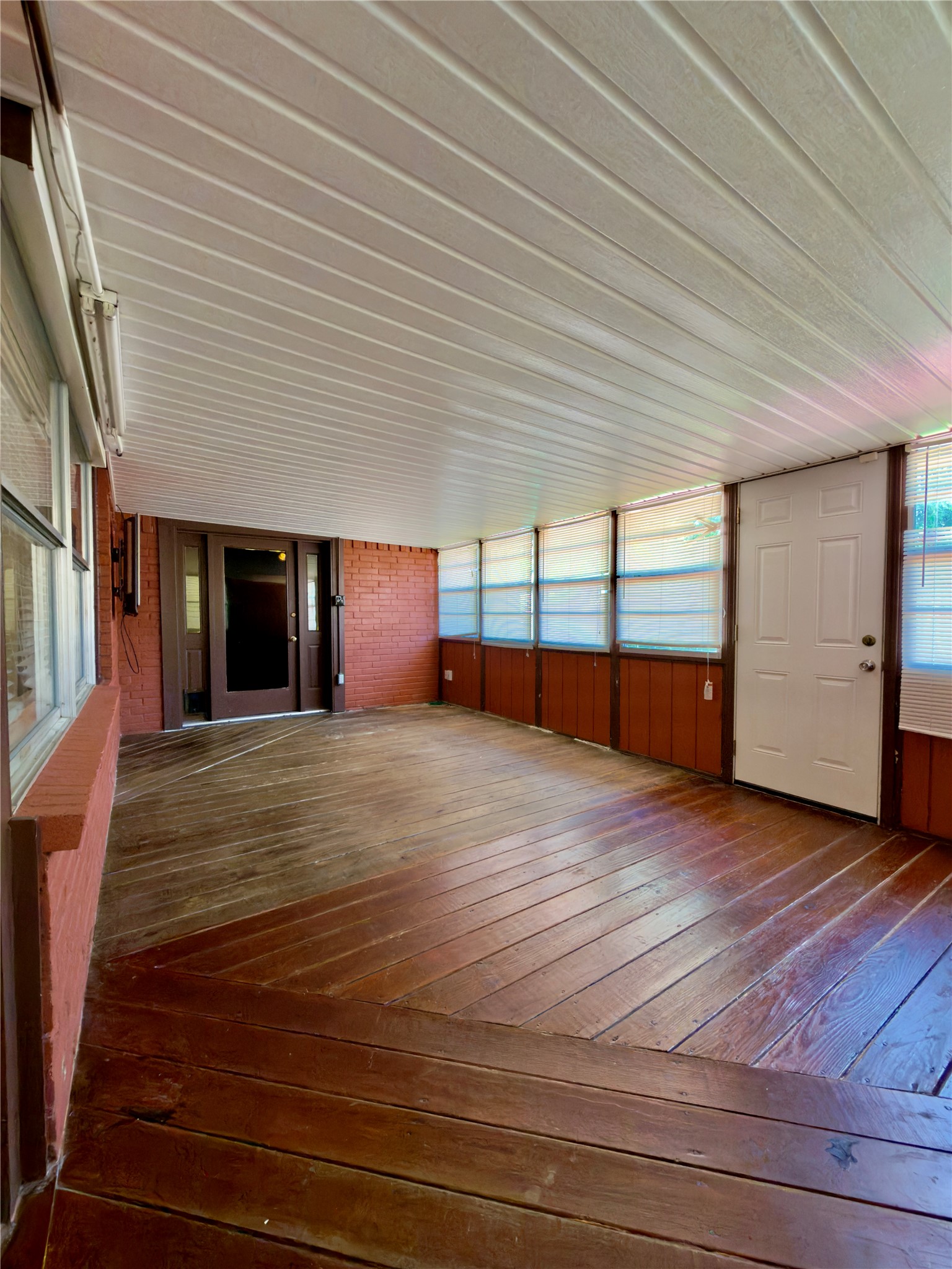 23115 Bright Star Road Spring, TX 77373 - Photo 7 of 14 an empty room with wooden floor and natural light