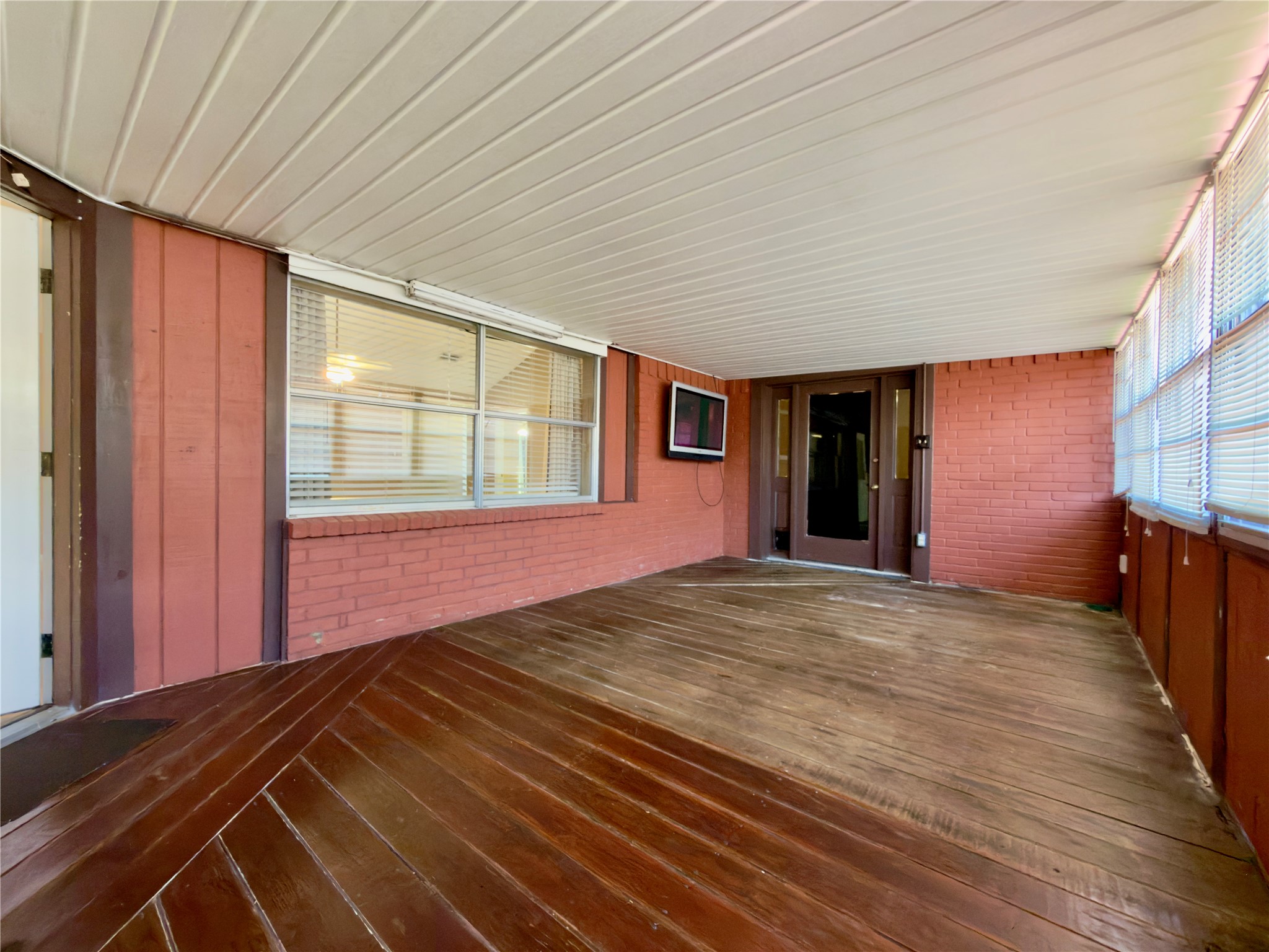 23115 Bright Star Road Spring, TX 77373 - Photo 8 of 14 a view of an empty room with wooden floor and a window