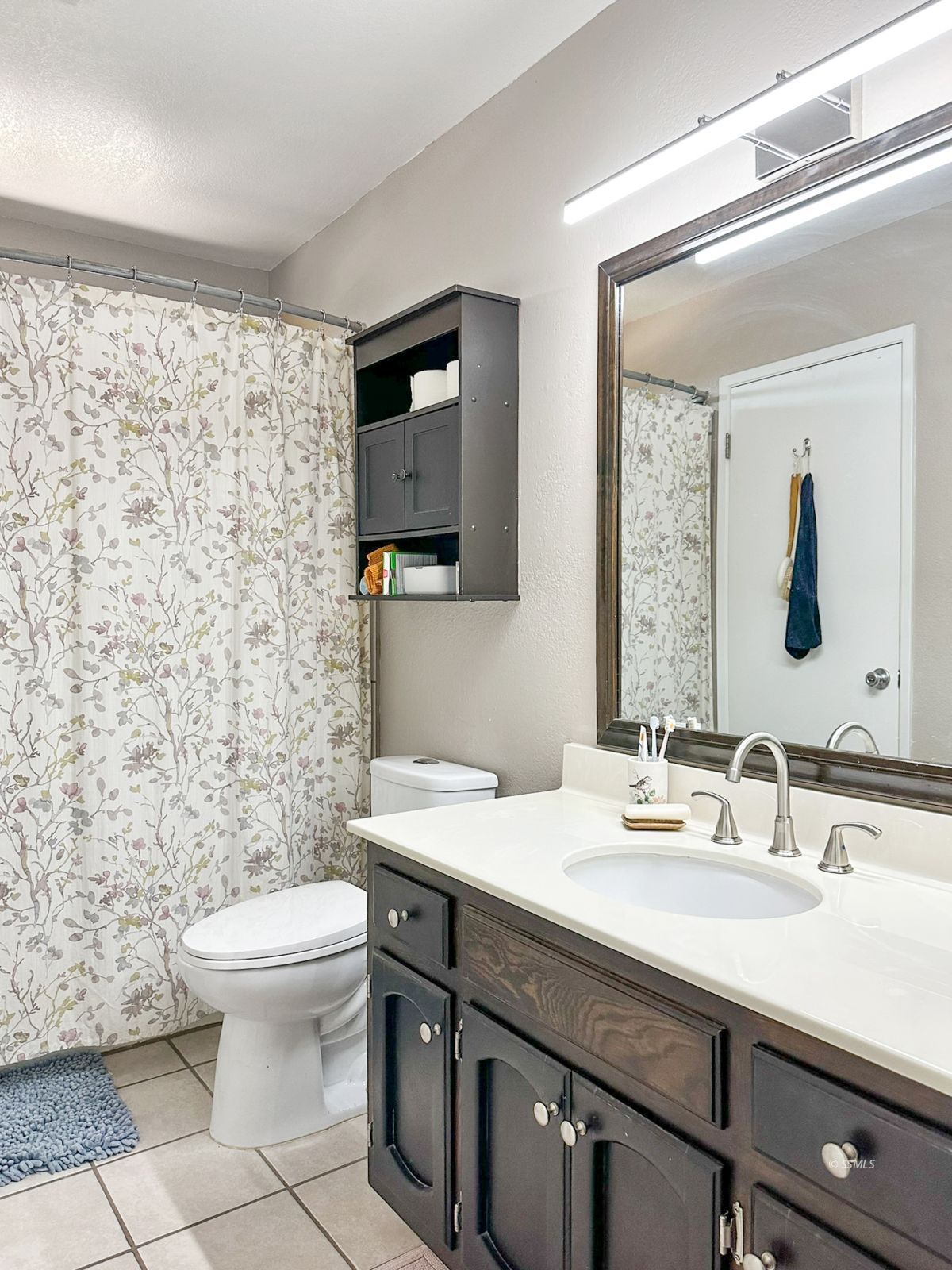 724 West Dolphin Avenue Ridgecrest, CA 93555 - Photo 33 of 50 a bathroom with a sink a toilet and a mirror