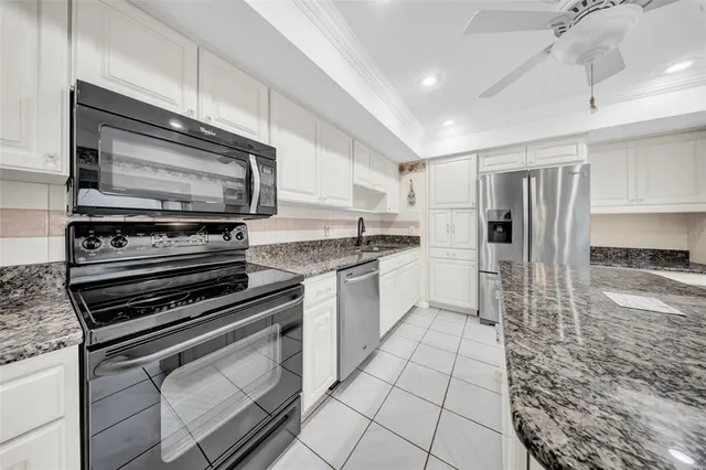 a kitchen with appliances and cabinets