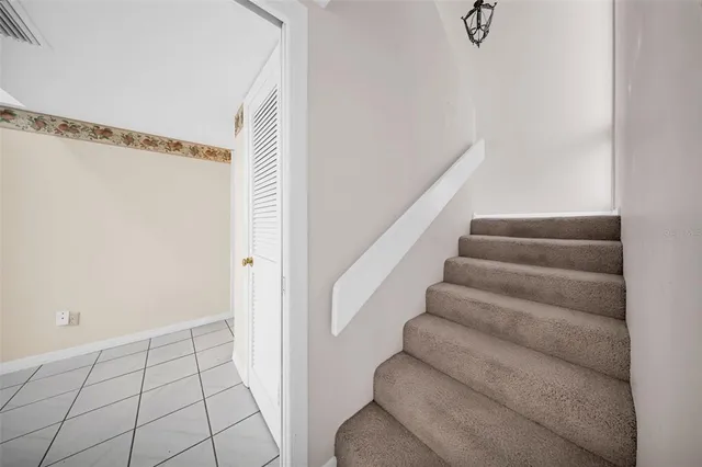a view of staircase with white walls