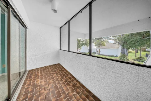 a view of an empty room with a large window