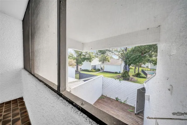 a view of a living room and a floor to ceiling window