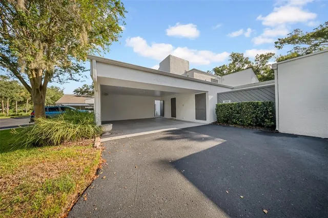 a view of a house with a yard and garage