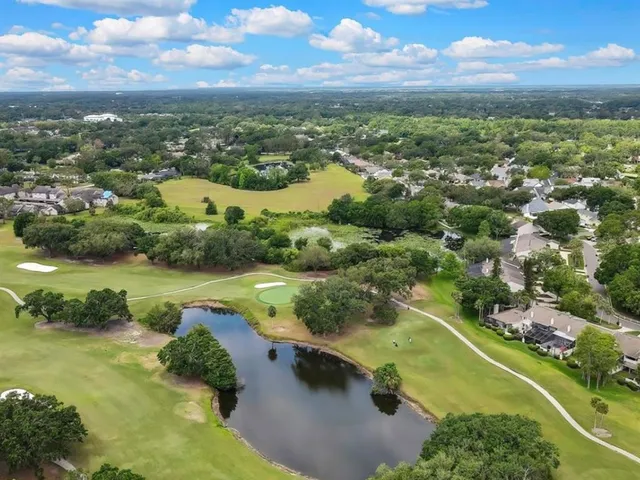 an aerial view of city and lake