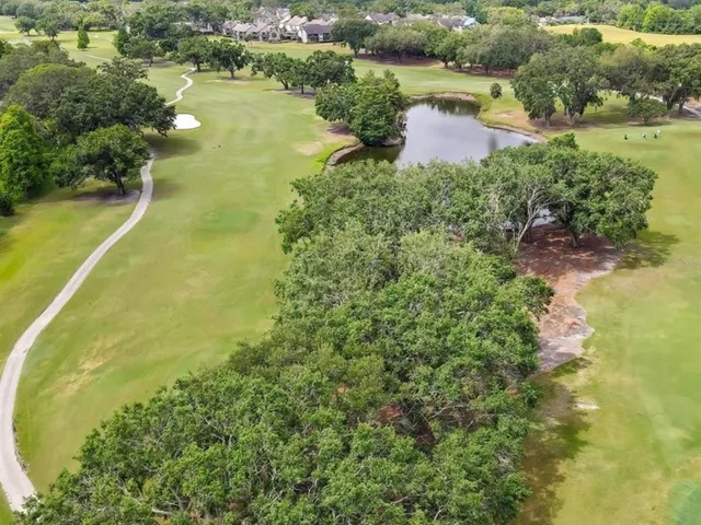 a view of a lake with a yard and lake view