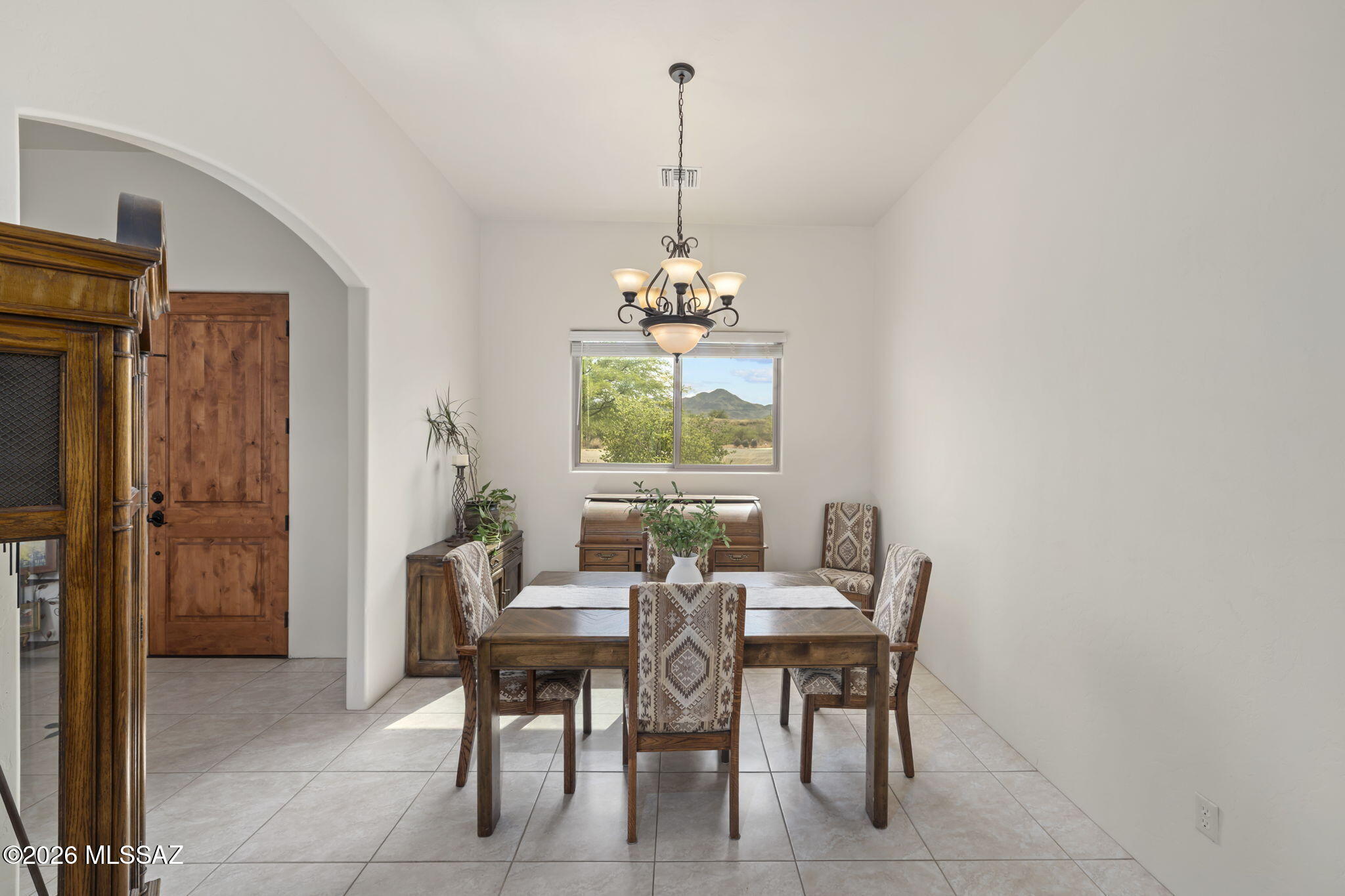 45 High View Court Tubac, AZ 85646 - Photo 13 of 44 a dining room with furniture a chandelier and window