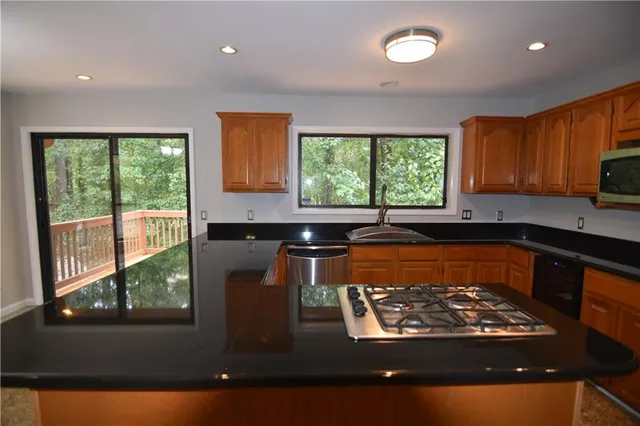 a view of a kitchen with a large window