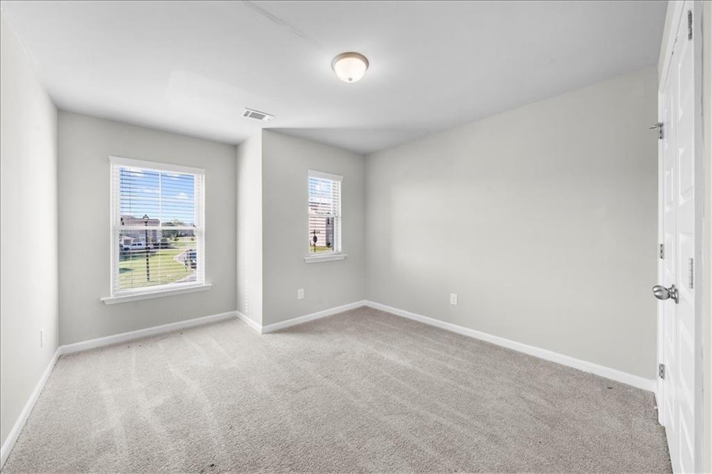 300 Harrison Street Calhoun, GA 30701 - Photo 10 of 17 an empty room with windows and closet
