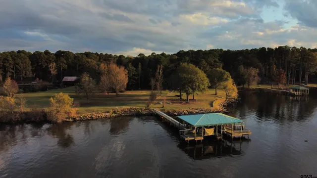 a view of swimming pool with a table and chairs