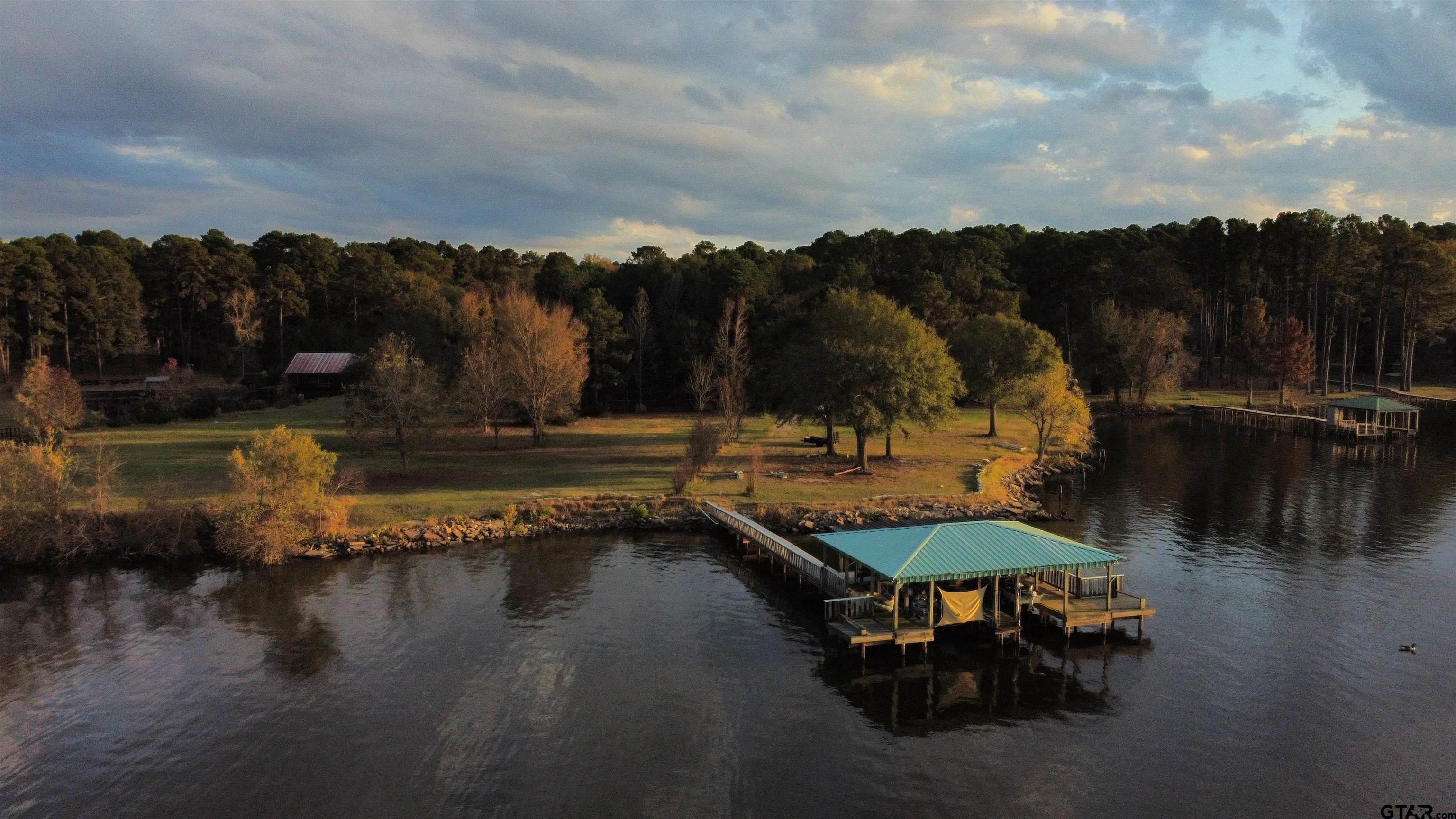 15722 Timberhill Drive Flint, TX 75762 - Photo 1 of 48 a view of swimming pool with a table and chairs