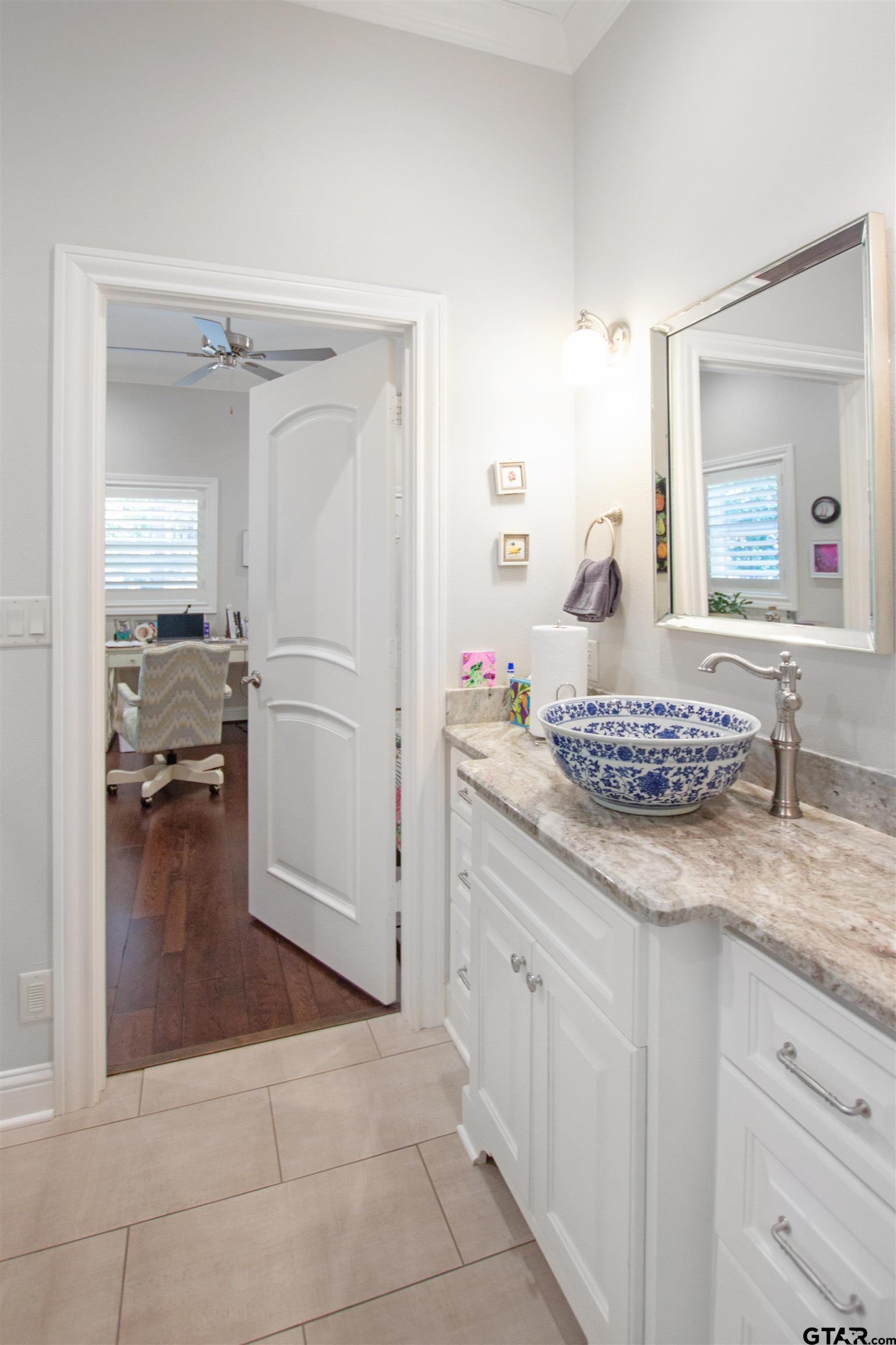 15722 Timberhill Drive Flint, TX 75762 - Photo 13 of 48 a bathroom with a sink and a mirror