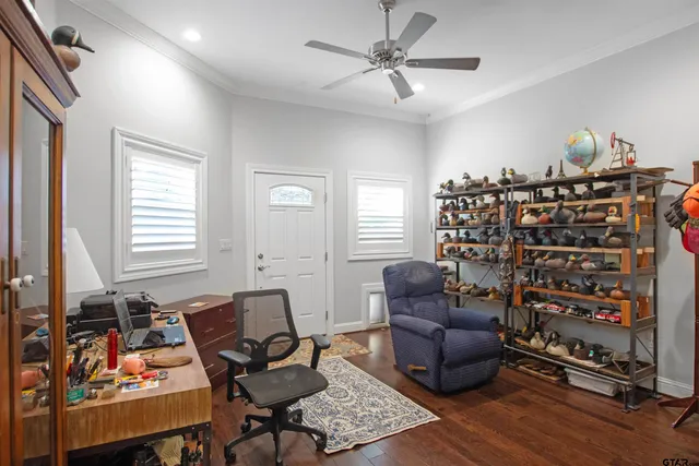 a living room with furniture a couch and a window