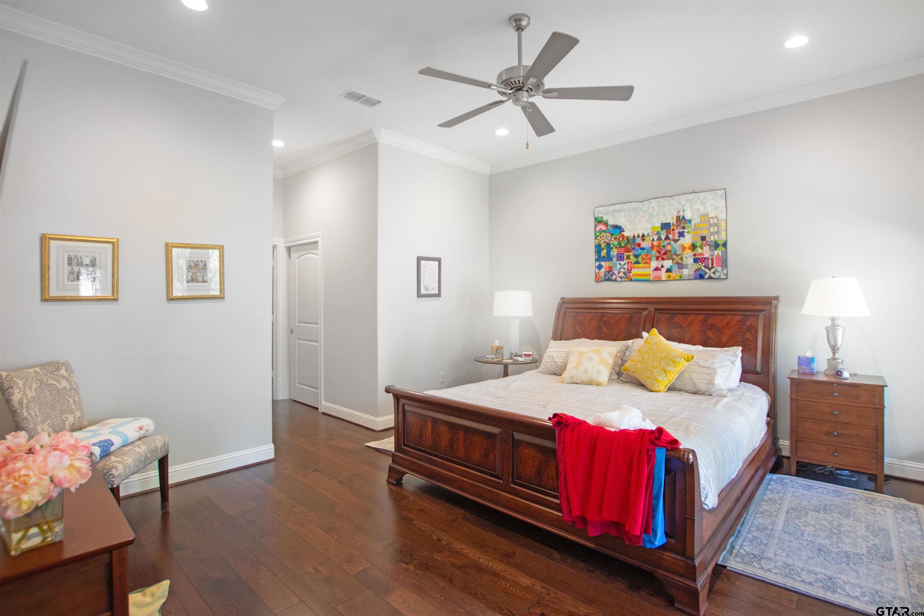 15722 Timberhill Drive Flint, TX 75762 - Photo 19 of 48 a bedroom with a bed and painting on the wall