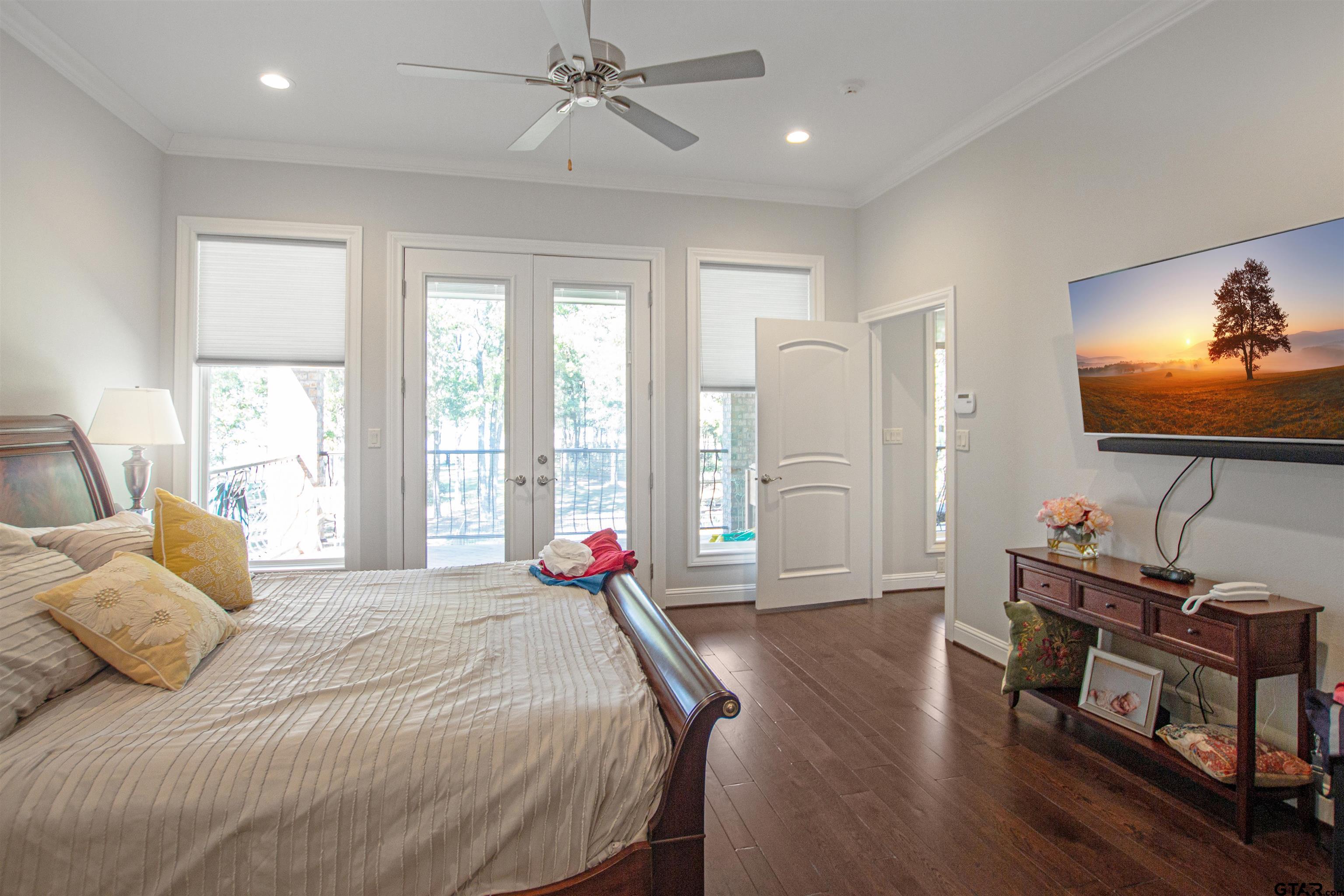 15722 Timberhill Drive Flint, TX 75762 - Photo 20 of 48 a bedroom with a bed and a flat screen tv