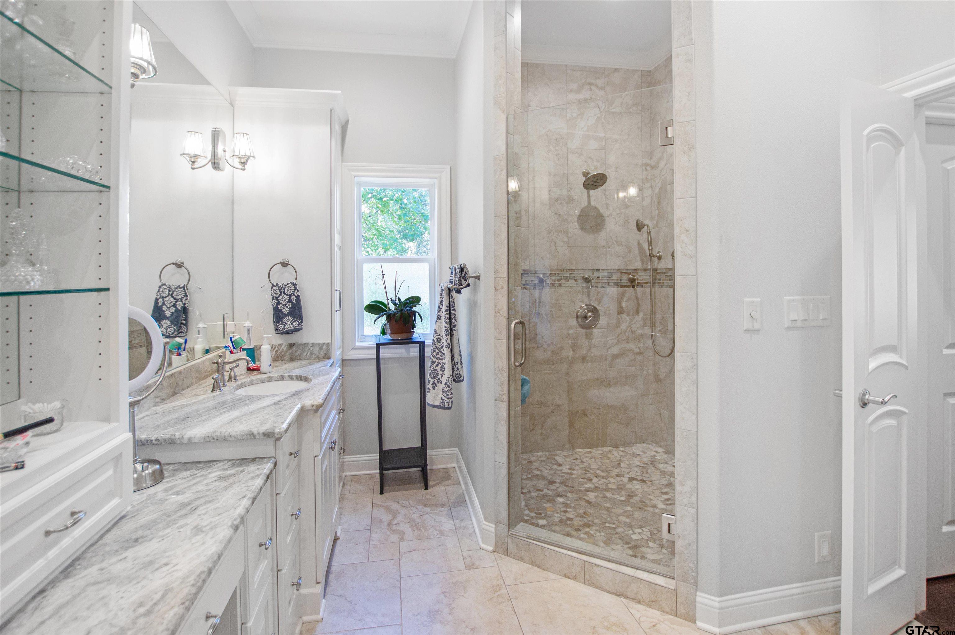 15722 Timberhill Drive Flint, TX 75762 - Photo 21 of 48 a bathroom with a double vanity sink mirror and shower