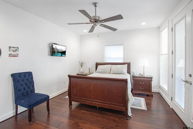 a bedroom with a bed and a chair