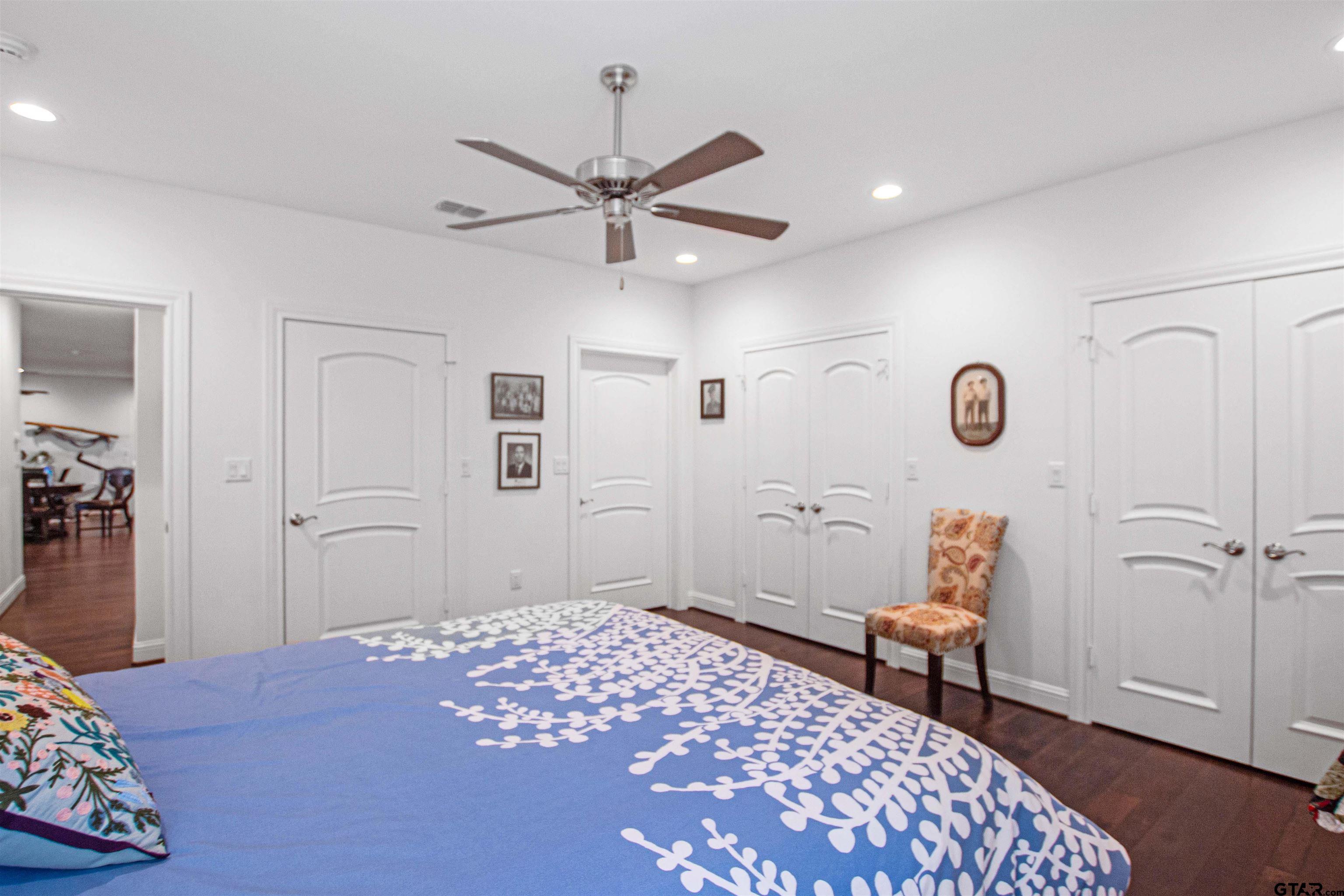 15722 Timberhill Drive Flint, TX 75762 - Photo 31 of 48 a bedroom with a bed and a chair