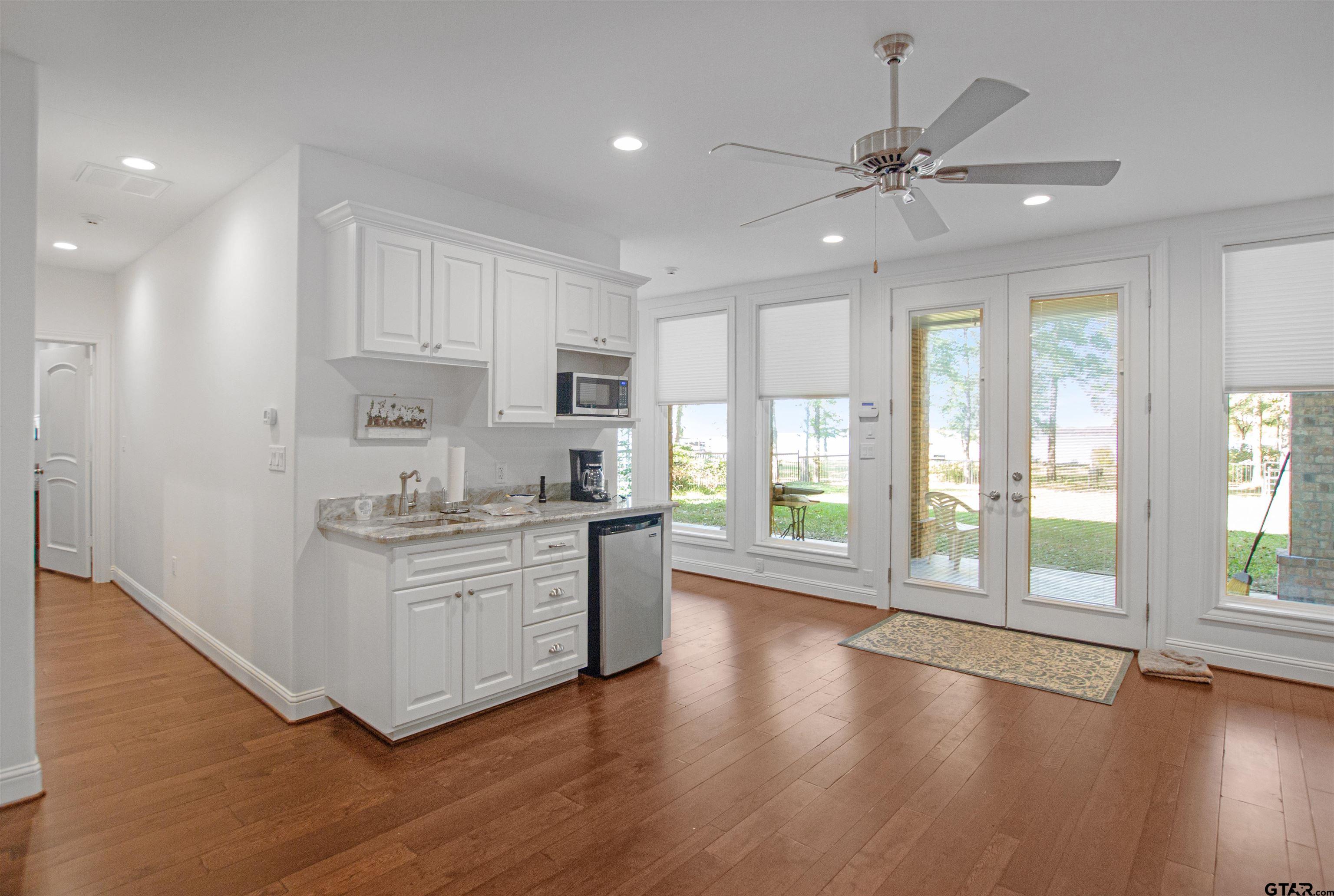 15722 Timberhill Drive Flint, TX 75762 - Photo 34 of 48 a kitchen with stainless steel appliances a white stove top oven and a large window