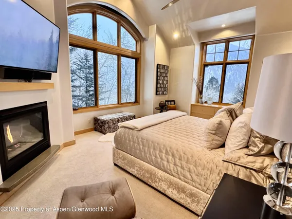 a bathroom with a tub a sink and a shower