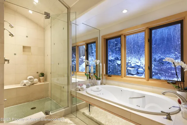 a living room with furniture and wall painting