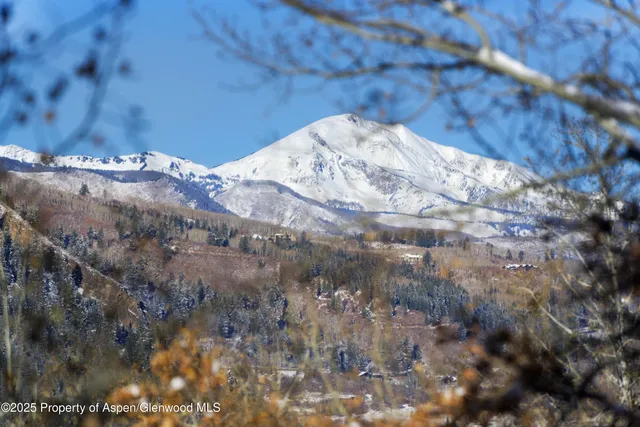 a spacious bathroom with a sink tub shower and a mirror