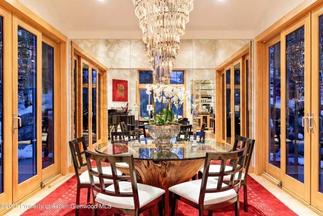 a living room with furniture fireplace and rug