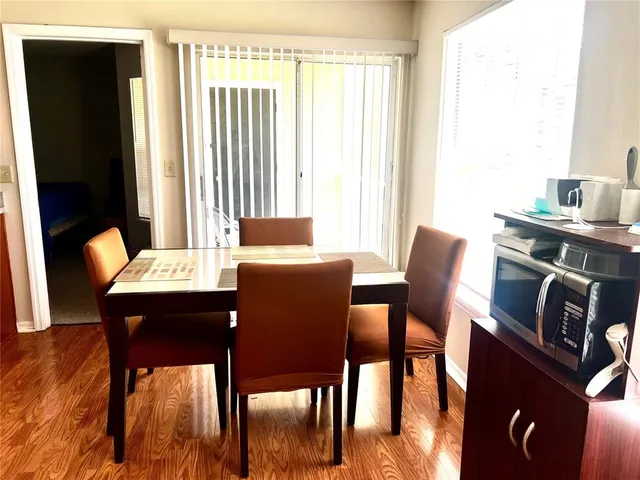 a view of a dining room with furniture window and outside view