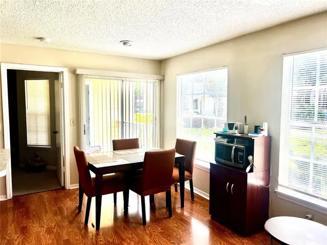 a kitchen with stainless steel appliances granite countertop a sink refrigerator and microwave