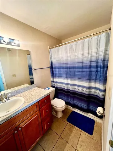 a room with wooden floor and window