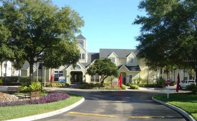 a view of a house with swimming pool and yard