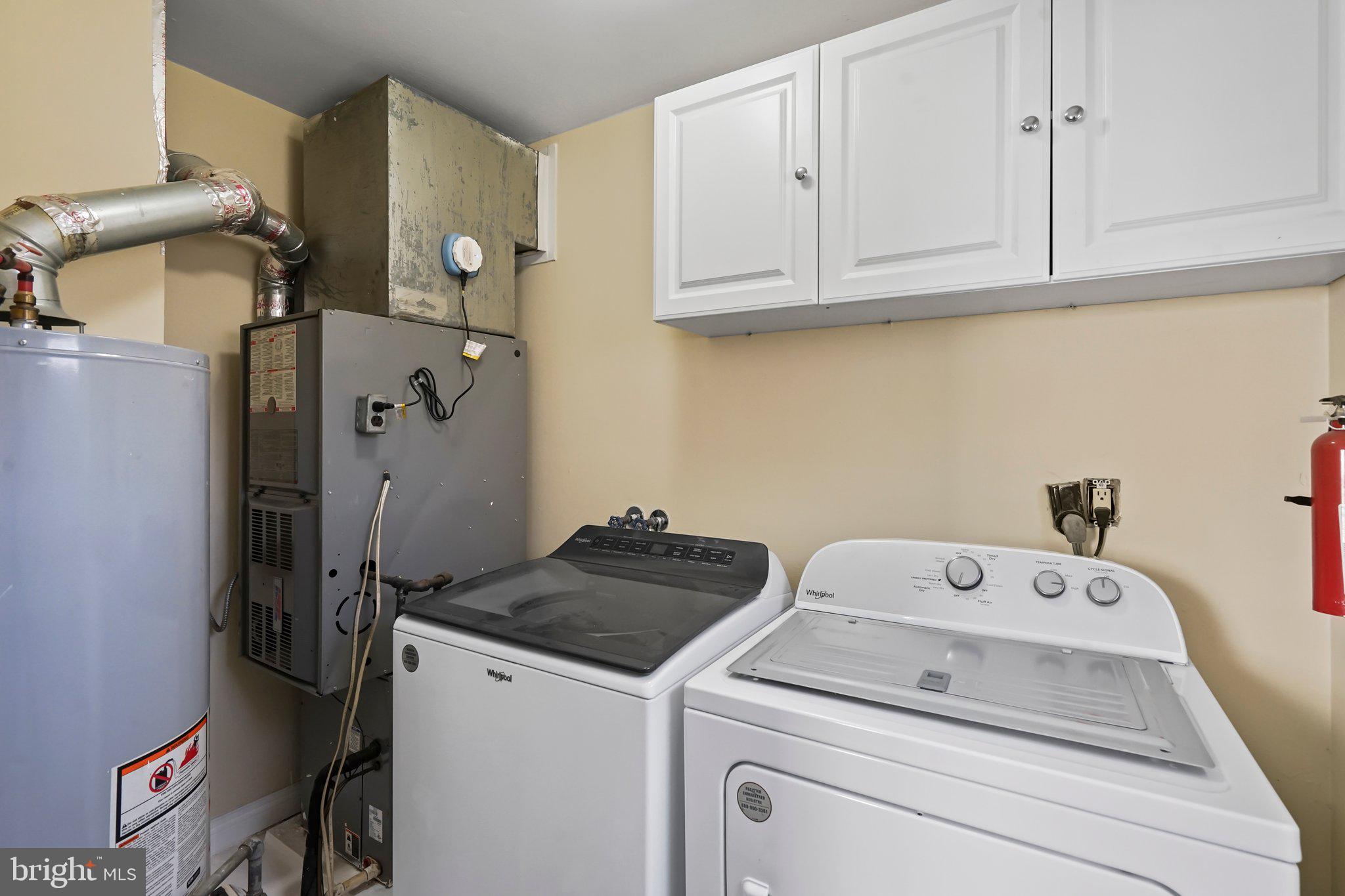 312 Wynnewood Road Ewing, NJ 08628 - Photo 16 of 24 a utility room with dryer and washer