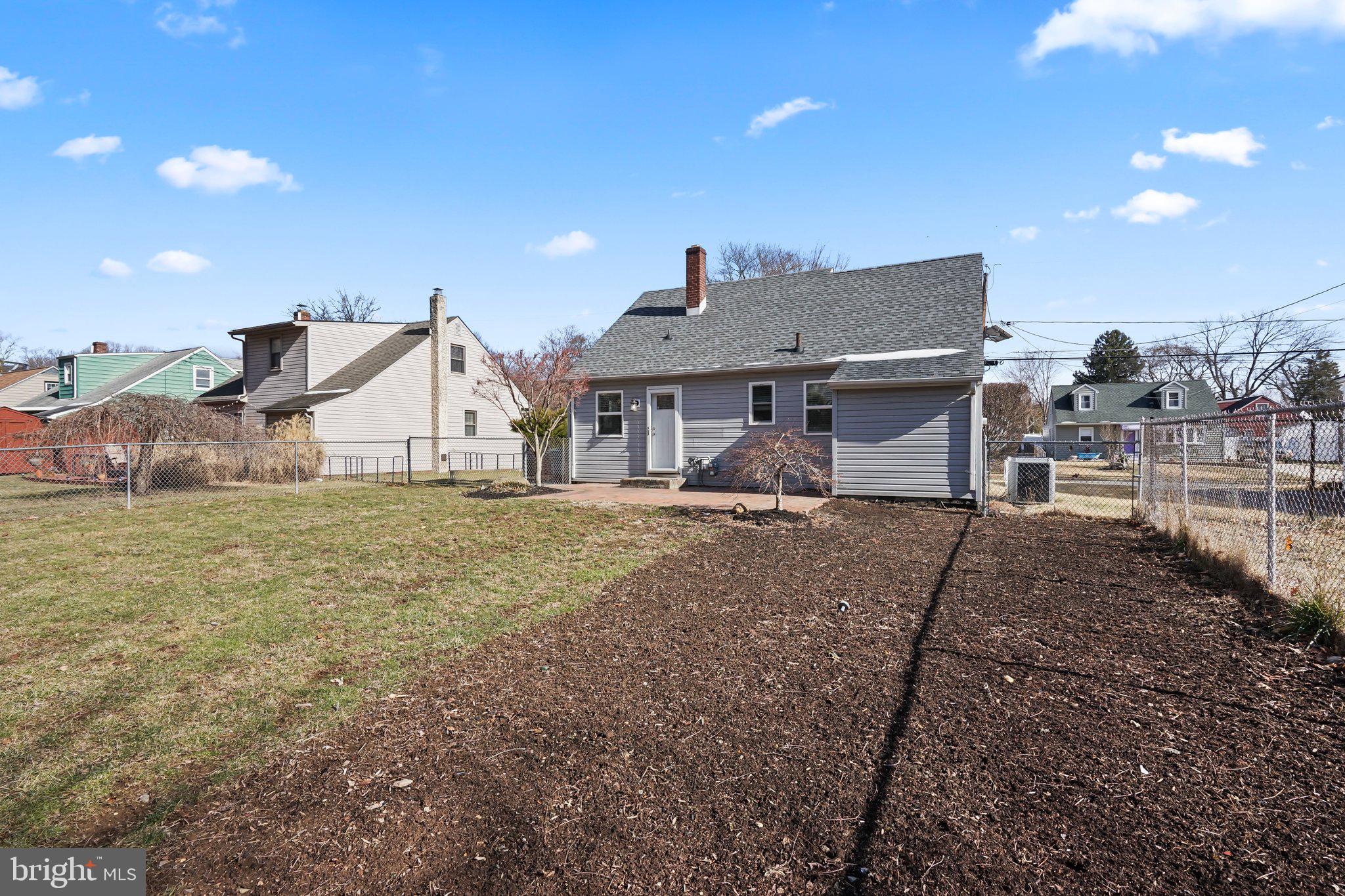 312 Wynnewood Road Ewing, NJ 08628 - Photo 19 of 24 a view of a house with a backyard