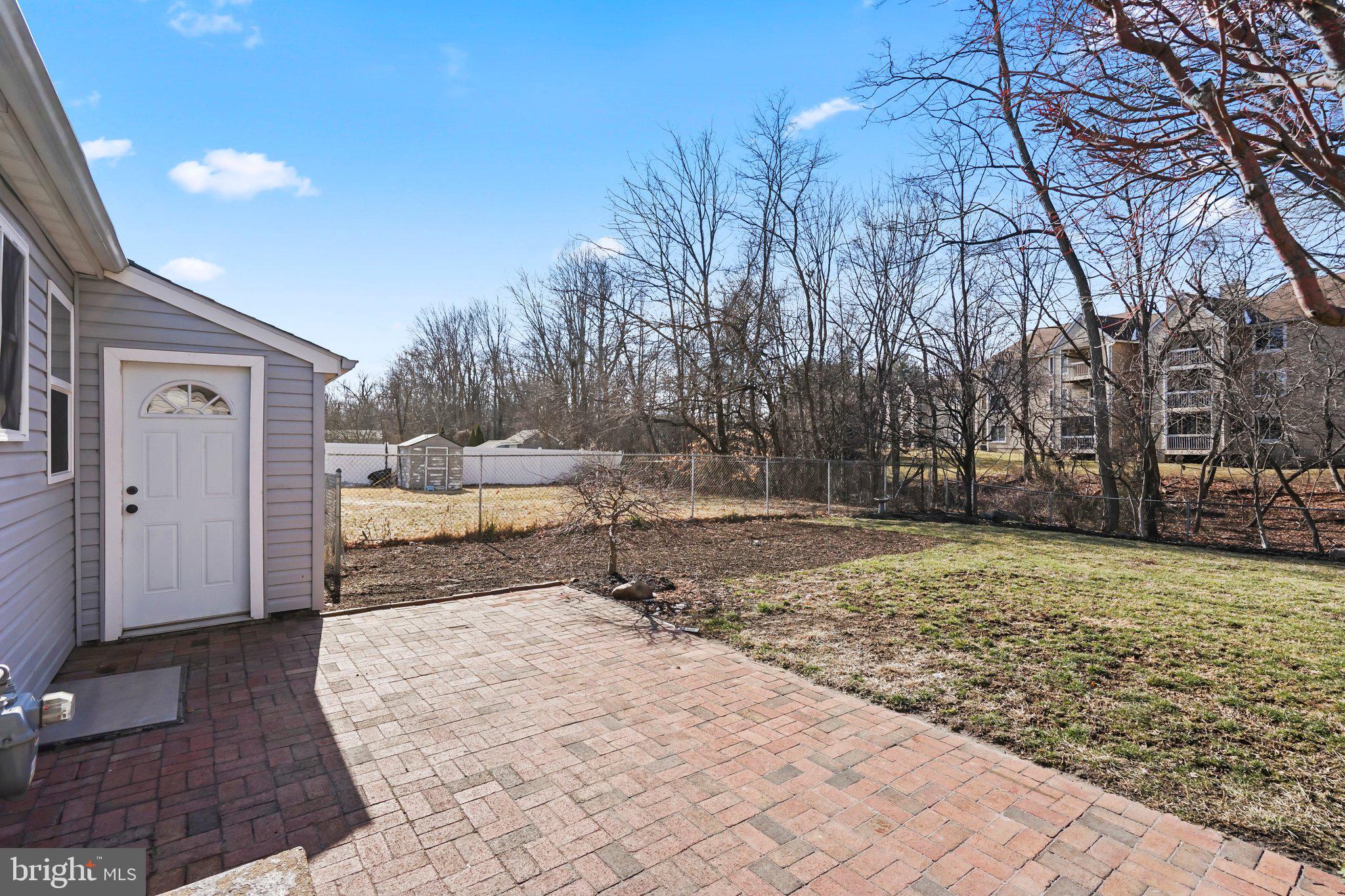 312 Wynnewood Road Ewing, NJ 08628 - Photo 20 of 24 a view of a yard with a tree