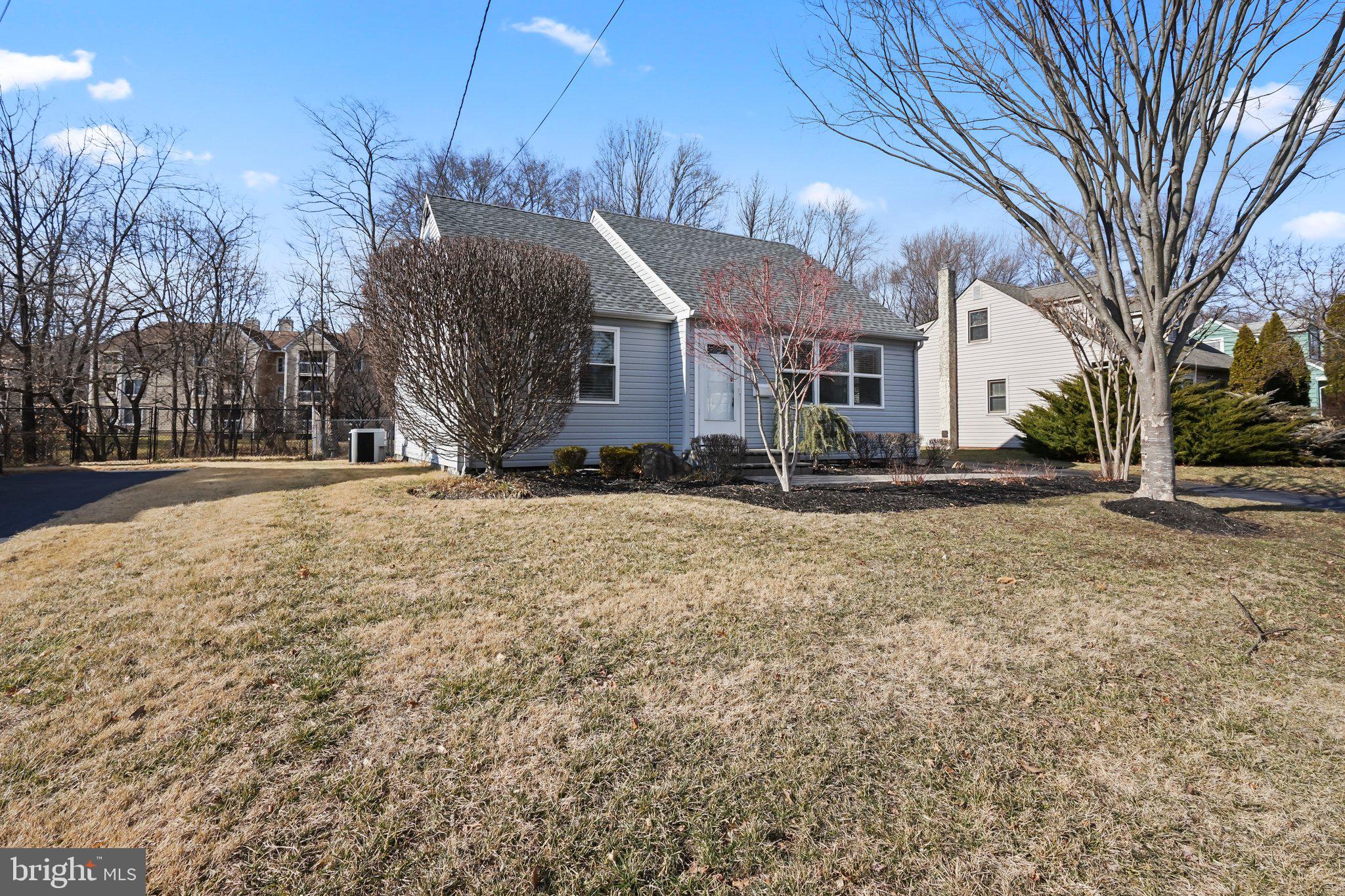 312 Wynnewood Road Ewing, NJ 08628 - Photo 21 of 24 a front view of house with yard and trees around