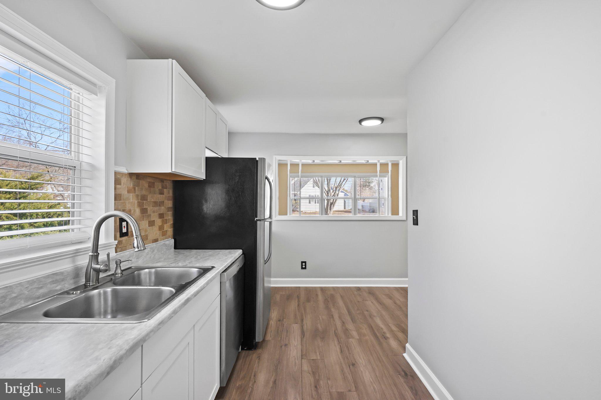 312 Wynnewood Road Ewing, NJ 08628 - Photo 6 of 24 a kitchen with sink and refrigerator