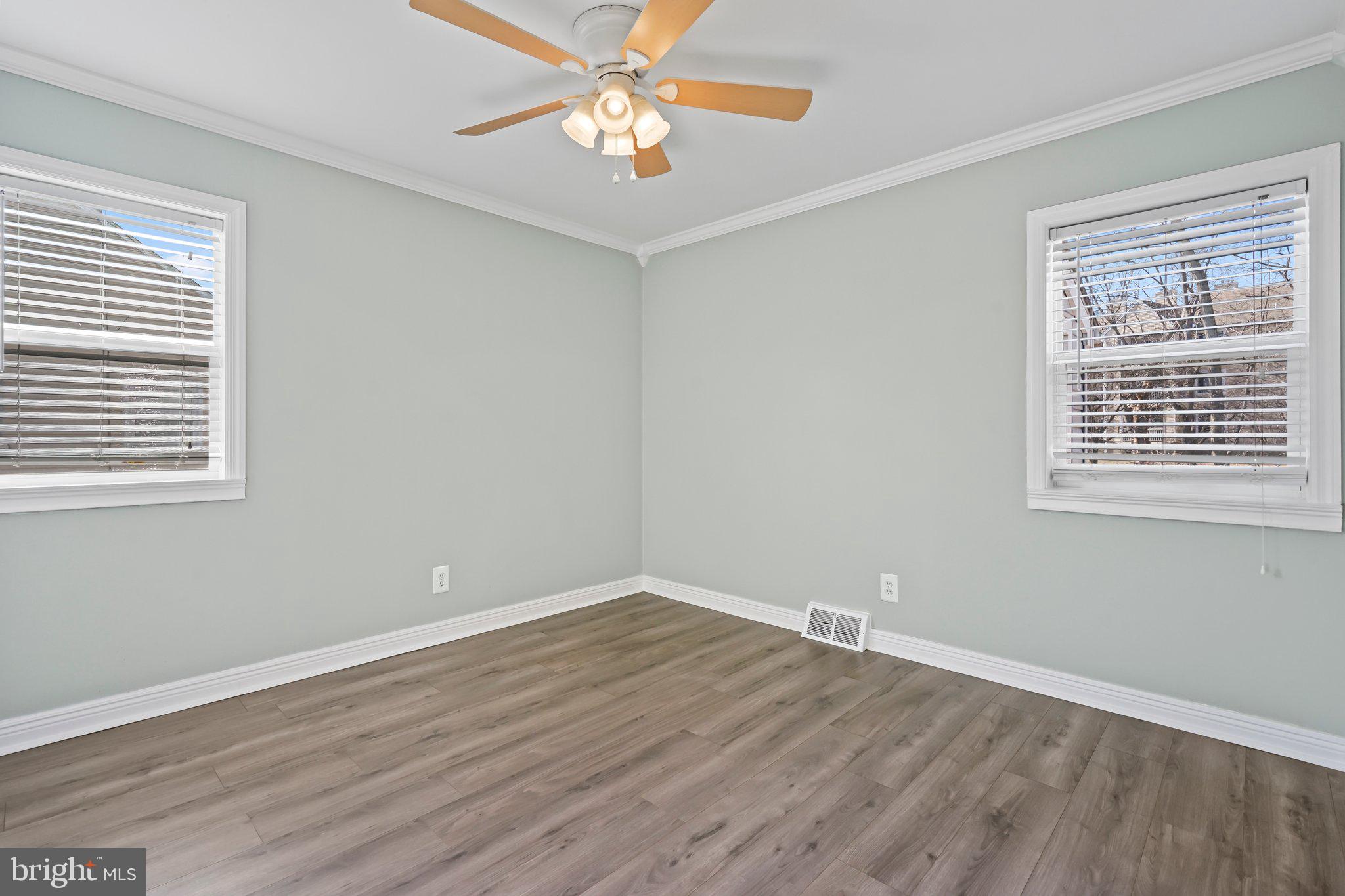 312 Wynnewood Road Ewing, NJ 08628 - Photo 8 of 24 a view of a room with wooden floor and windows